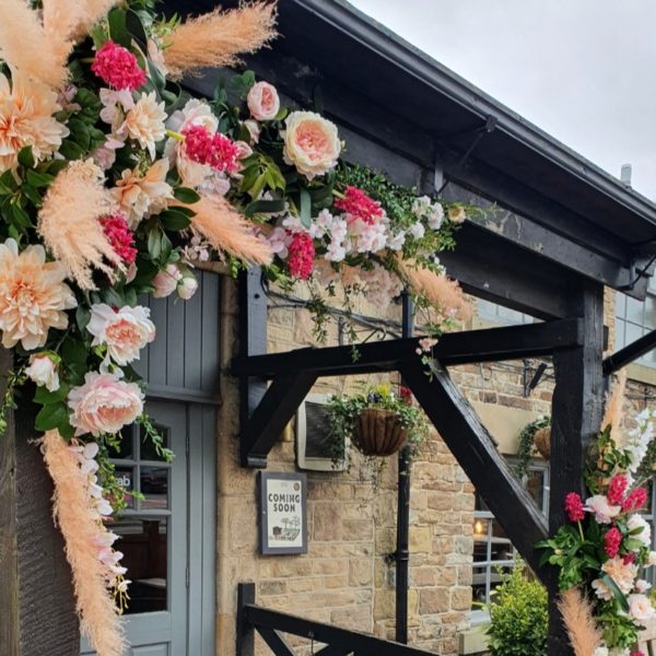 Flower arch at The Waggon and Horses